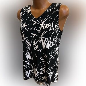 Chico’s black & white sleeveless slinky Travelers shell lovely! Like new 2 /L 14